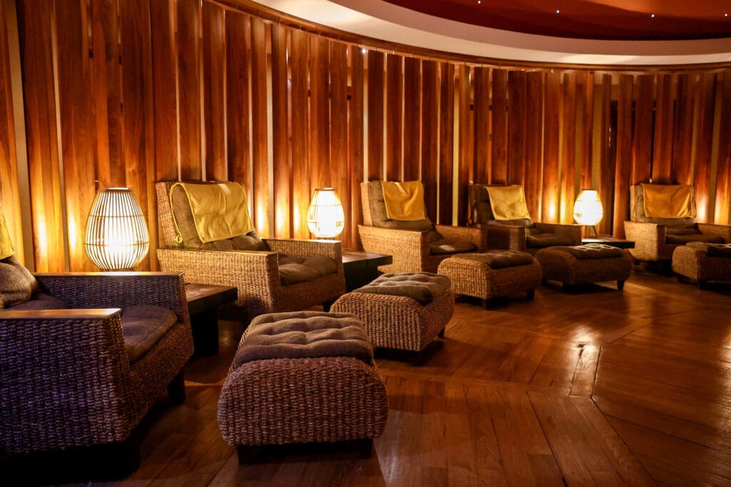 Relaxation room with low lighting, comfortable chairs, footrests and a starry ceiling — a calming Tipperary wellness space